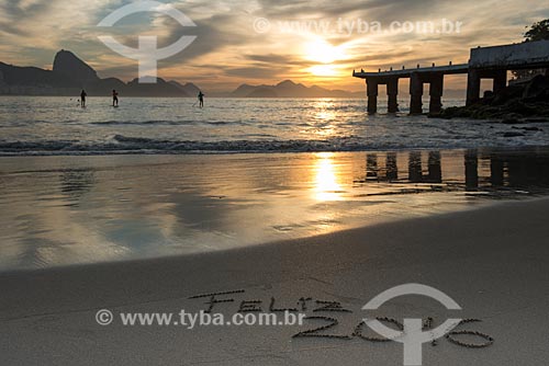  Sand that says: Happy 2016 - post 6 of Copacabana Beach with the Sugar Loaf in the background  - Rio de Janeiro city - Rio de Janeiro state (RJ) - Brazil