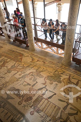  Tourists observing the mosaic known as Great Hunt - Villa Romana del Casale - old palace building IV century  - Piazza Armerina city - Enna province - Italy