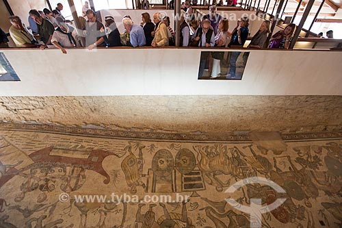  Tourists observing the mosaic known as Great Hunt - Villa Romana del Casale - old palace building IV century  - Piazza Armerina city - Enna province - Italy