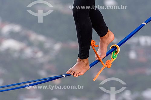  Practitioner of slackline on the top of Rock of Gavea  - Rio de Janeiro city - Rio de Janeiro state (RJ) - Brazil