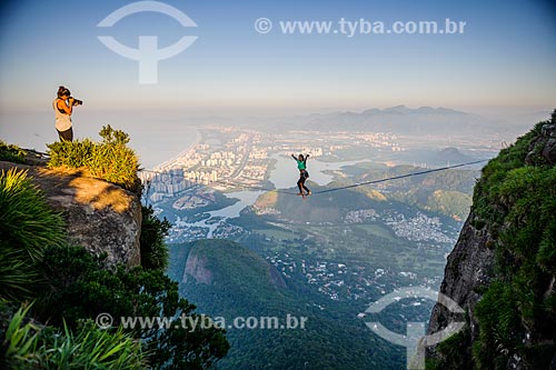  Practitioner of slackline o the top of Rock of Gavea - Barra da Tijuca in the background  - Rio de Janeiro city - Rio de Janeiro state (RJ) - Brazil