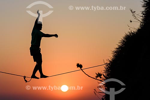  Practitioner of slackline o the top of Rock of Gavea  - Rio de Janeiro city - Rio de Janeiro state (RJ) - Brazil