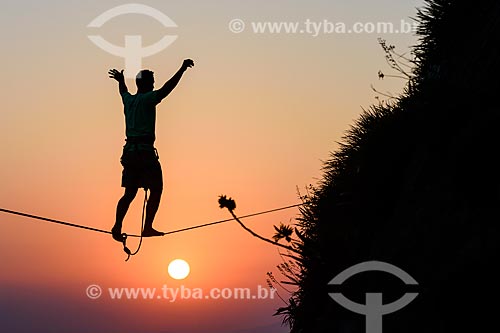  Practitioner of slackline o the top of Rock of Gavea  - Rio de Janeiro city - Rio de Janeiro state (RJ) - Brazil