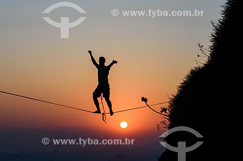  Practitioner of slackline o the top of Rock of Gavea  - Rio de Janeiro city - Rio de Janeiro state (RJ) - Brazil