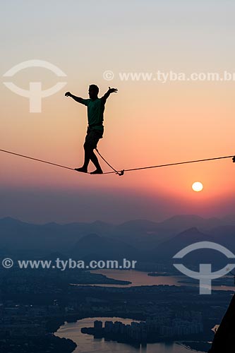  Practitioner of slackline o the top of Rock of Gavea - Barra da Tijuca in the background  - Rio de Janeiro city - Rio de Janeiro state (RJ) - Brazil