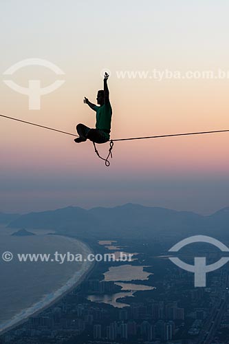  Practitioner of slackline o the top of Rock of Gavea - Barra da Tijuca in the background  - Rio de Janeiro city - Rio de Janeiro state (RJ) - Brazil