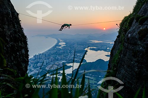  Practitioner of slackline o the top of Rock of Gavea - Barra da Tijuca in the background  - Rio de Janeiro city - Rio de Janeiro state (RJ) - Brazil