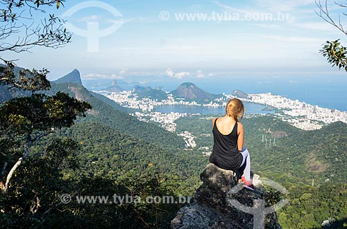  Woman observing the view from trail of Queimado Mountain with the Christ the Redeemer, Rodrigo de Freitas Lagoon and the Sugar Loaf in the background  - Rio de Janeiro city - Rio de Janeiro state (RJ) - Brazil
