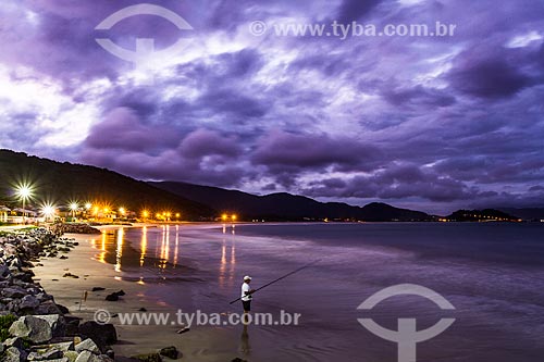  Man fishing at Armacao Beach at dusk  - Florianopolis city - Santa Catarina state (SC) - Brazil