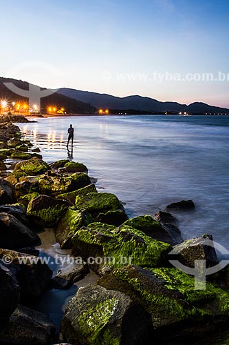  Man fishing at Armacao Beach at dusk  - Florianopolis city - Santa Catarina state (SC) - Brazil