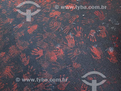  Detail of red handprints on asphalt - protest against violence against women  - Porto Alegre city - Rio Grande do Sul state (RS) - Brazil