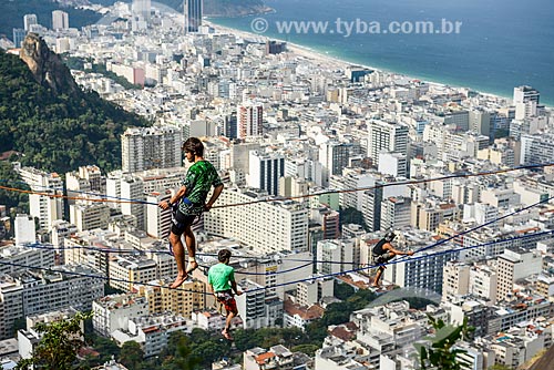  Practitioner of slackline - Cabritos Mountain (Kid Goat Mountain) - with the Copacabana neighborhood in the background  - Rio de Janeiro city - Rio de Janeiro state (RJ) - Brazil