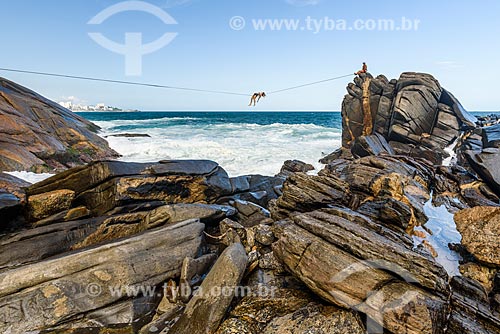  Practitioner of slackline - rock formation konwn as Castelinho do Leblon near to Mirante of Leblon  - Rio de Janeiro city - Rio de Janeiro state (RJ) - Brazil