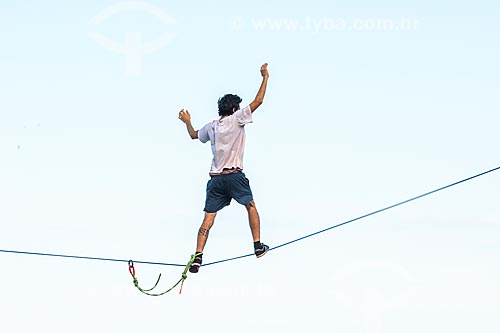  Practitioner of slackline - rock formation konwn as Castelinho do Leblon near to Mirante of Leblon  - Rio de Janeiro city - Rio de Janeiro state (RJ) - Brazil