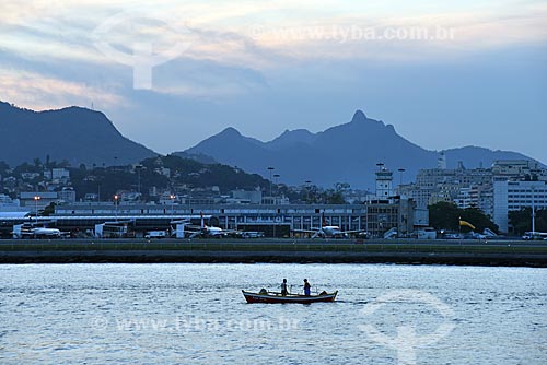  View of canoe with the Santos Dumont Airport in the background during the Rio Boulevard Tour - boat sightseeing in Guanabara Bay  - Rio de Janeiro city - Rio de Janeiro state (RJ) - Brazil