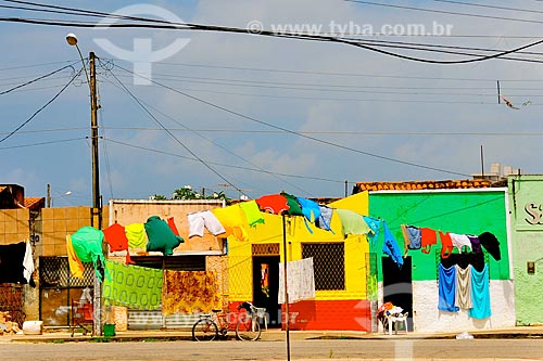  Clothes on clothes line with houses - Natal suburb in the background  - Natal city - Rio Grande do Norte state (RN) - Brazil