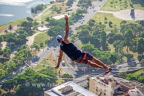  Detail of man practicing Side plank pose movement (Vashistasana) - slackline - Cantagalo Hill  - Rio de Janeiro city - Rio de Janeiro state (RJ) - Brazil