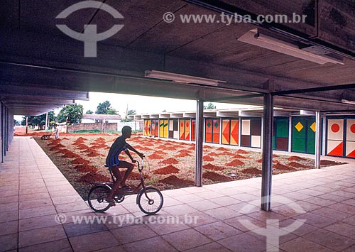  Child riding bicycles on school during the construction of Brasilia with painting the enamel on wood and glass by Athos Bulcão in doors  - Brasilia city - Distrito Federal (Federal District) (DF) - Brazil