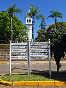  Sign with distances from Cotiporo and Nossa Senhora da Saude Church in the background  - Cotipora city - Rio Grande do Sul state (RS) - Brazil