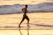 Man running on the sand of Copacabana Beach - Post 6 - Rio de Janeiro city - Rio de Janeiro state (RJ) - Brazil