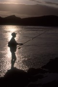 Silhouette of a man fishing at sunset in Boca da Barra - Cabo Frio city - Rio de Janeiro state (RJ) - Brazil