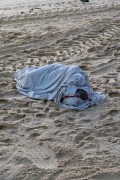 Homeless sleeping on the sand of Copacabana Beach - Rio de Janeiro city - Rio de Janeiro state (RJ) - Brazil