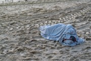 Homeless sleeping on the sand of Copacabana Beach - Rio de Janeiro city - Rio de Janeiro state (RJ) - Brazil