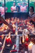 Faithful lighting candles - Church of the Martyrs Sao Gonçalo Garcia and Sao Jorge, better known as the Church of Sao Jorge - Located on the corner of Alfandega Street and Republica Square - Rio de Janeiro city - Rio de Janeiro state (RJ) - Brazil