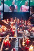 Faithful lighting candles - Church of the Martyrs Sao Gonçalo Garcia and Sao Jorge, better known as the Church of Sao Jorge - Located on the corner of Alfandega Street and Republica Square - Rio de Janeiro city - Rio de Janeiro state (RJ) - Brazil