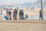 Municipal Guards from the Special Operations Group (GOE) approaching homeless people on Copacabana Beach - Rio de Janeiro city - Rio de Janeiro state (RJ) - Brazil