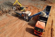 Picture taken with drone of tree chipper working on biomass production in a rubber plantation that was eradicated - Planalto city - Sao Paulo state (SP) - Brazil