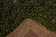 Picture taken with drone of an agricultural machine preparing the soil for planting - Itapua do Oeste city - Rondonia state (RO) - Brazil