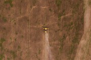 Picture taken with drone of an agricultural machine preparing the soil for planting - Itapua do Oeste city - Rondonia state (RO) - Brazil