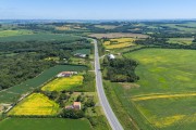 Photo taken with a drone of the BR-476 Highway (Schisto Highway) and small rural properties - Lapa city - Parana state (PR) - Brazil