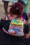 Woman with colorful backpack on Copacabana Beach - Rio de Janeiro city - Rio de Janeiro state (RJ) - Brazil