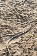 Hose with holes to wet the sand - Copacabana Beach - Rio de Janeiro city - Rio de Janeiro state (RJ) - Brazil