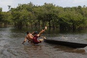 Riverine children from the Sao Joao do Jacu Community playing in the river - Parintins city - Amazonas state (AM) - Brazil