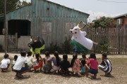 Children playing Boi Corre Campo dressed in black and Boi Tira Prosa dressed in white in the community of São Sebastiao do Jara - Parintins city - Amazonas state (AM) - Brazil