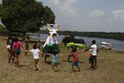 Children playing Boi Corre Campo dressed in black and Boi Tira Prosa dressed in white in the community of São Sebastiao do Jara - Parintins city - Amazonas state (AM) - Brazil