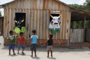 Children playing Boi Corre Campo dressed in black and Boi Tira Prosa dressed in white in the community of São Sebastiao do Jara - Parintins city - Amazonas state (AM) - Brazil