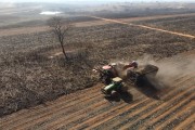 Picture taken with drone of sugarcane harvesting in a sugarcane field hit by fire - Poloni city - Sao Paulo state (SP) - Brazil