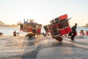 Detail of cargo trolley - man carrying a cart - with beach chairs - Copacabana Beach waterfront - Rio de Janeiro city - Rio de Janeiro state (RJ) - Brazil