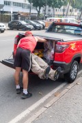 Fire Department vehicle carrying a mannequin dressed in the corporations uniform in the trunk - Celebration of the 132nd Anniversary of Copacabana (1892-2024) - Rio de Janeiro city - Rio de Janeiro state (RJ) - Brazil