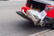 Fire Department vehicle carrying a mannequin dressed in the corporations uniform in the trunk - Celebration of the 132nd Anniversary of Copacabana (1892-2024) - Rio de Janeiro city - Rio de Janeiro state (RJ) - Brazil