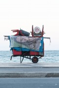 Detail of cargo trolley - man carrying a cart - with beach chairs - Copacabana Beach waterfront - Rio de Janeiro city - Rio de Janeiro state (RJ) - Brazil