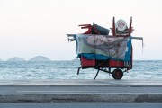 Detail of cargo trolley - man carrying a cart - with beach chairs - Copacabana Beach waterfront - Rio de Janeiro city - Rio de Janeiro state (RJ) - Brazil