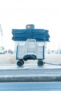 Detail of cargo trolley - man carrying a cart - with beach chairs - Copacabana Beach waterfront - Rio de Janeiro city - Rio de Janeiro state (RJ) - Brazil