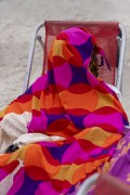 Bather protecting herself from the sun with a Kanga beach - Copacabana Beach - Rio de Janeiro city - Rio de Janeiro state (RJ) - Brazil