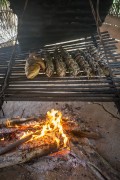 Fish being cooked over a fire in the traditional indigenous Moquem style - Cipia Village - Manaus city - Amazonas state (AM) - Brazil