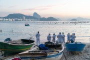 Group of people paying homage to Yemanja at sunrise at the Z-13 fishing colony at Post 6 on Copacabana Beach - Rio de Janeiro city - Rio de Janeiro state (RJ) - Brazil